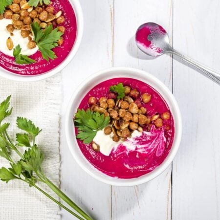 Two bowls of beetroots soup with chickpea and sour cream topping. | Hurry The Food Up