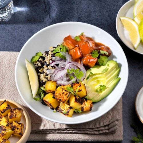 Black Bean Burrito Bowl is served with greek yogurt, lemon wedges, cilantro and fried tofu | Hurry The Food Up