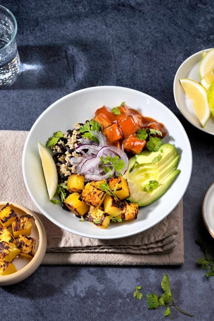 Black Bean Burrito Bowl is served with greek yogurt, lemon wedges, cilantro and fried tofu | Hurry The Food Up