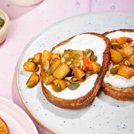 A plate with two slices of healthy French toast with apple and pumpkin seed mixture and cream cheese. | Hurry The Food Up