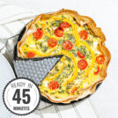 The high-protein tortilla quiche on the black pan with a time badge in the bottom left corner | Hurry The Food Up