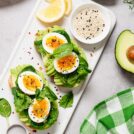 Healthy toast with sliced avocado, boiled eggs, spices and fresh spinach | Hurry The Food Up