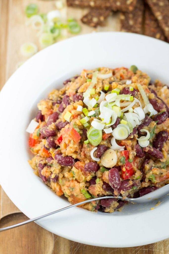 Vegan Lentil and Bean Salad is served on the plate on a table with bread | Hurry The Food Up