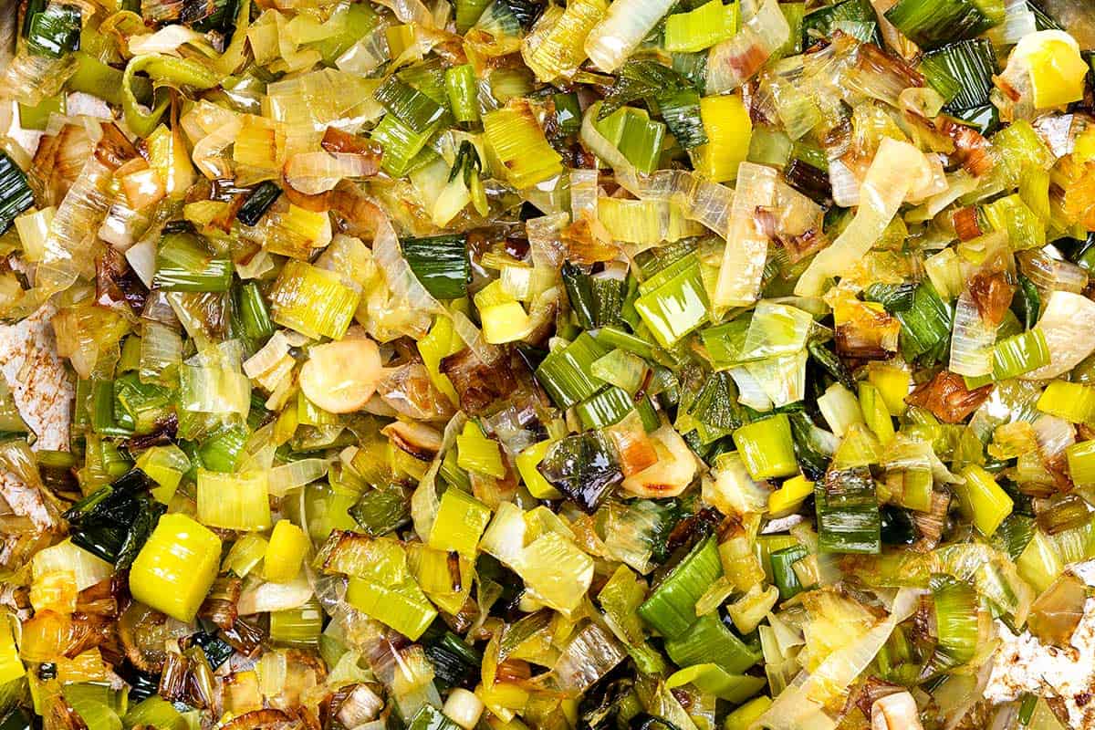 A shot of the process of cooking leek and potato soup, showing fried leeks shot from a bird's eye view. | Hurry The Food Up