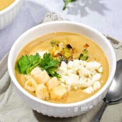 Leek and potato soup, topped with fresh parsley, croutons and sour cream and served in a bowl. | Hurry The Food Up