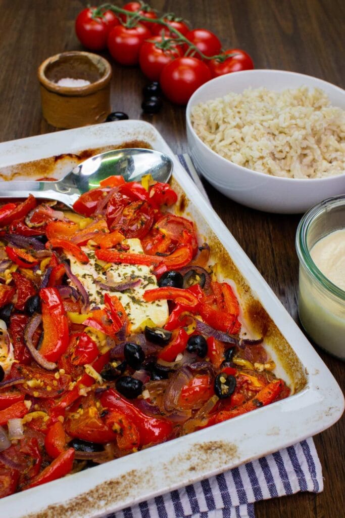 A tray full of roasted veggies and melted feta with rice | Hurry The Food Up