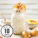 The Mason jar with overnight oats is on the marble surface. There are some hazelnuts, two bronze spoons, a tiny bowl with peanut butter and a small dish with some slices of peach with a time badge in the bottom left corner | Hurry The Food Up