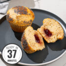 Protein muffins are on the dark plate with a time badge in the bottom left corner | Hurry The Food Up