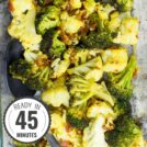 Roasted Broccoli and Cauliflower is spread unto a baking sheet in a single layer with time stamp in the bottom left hand corner | Hurry The Food Up