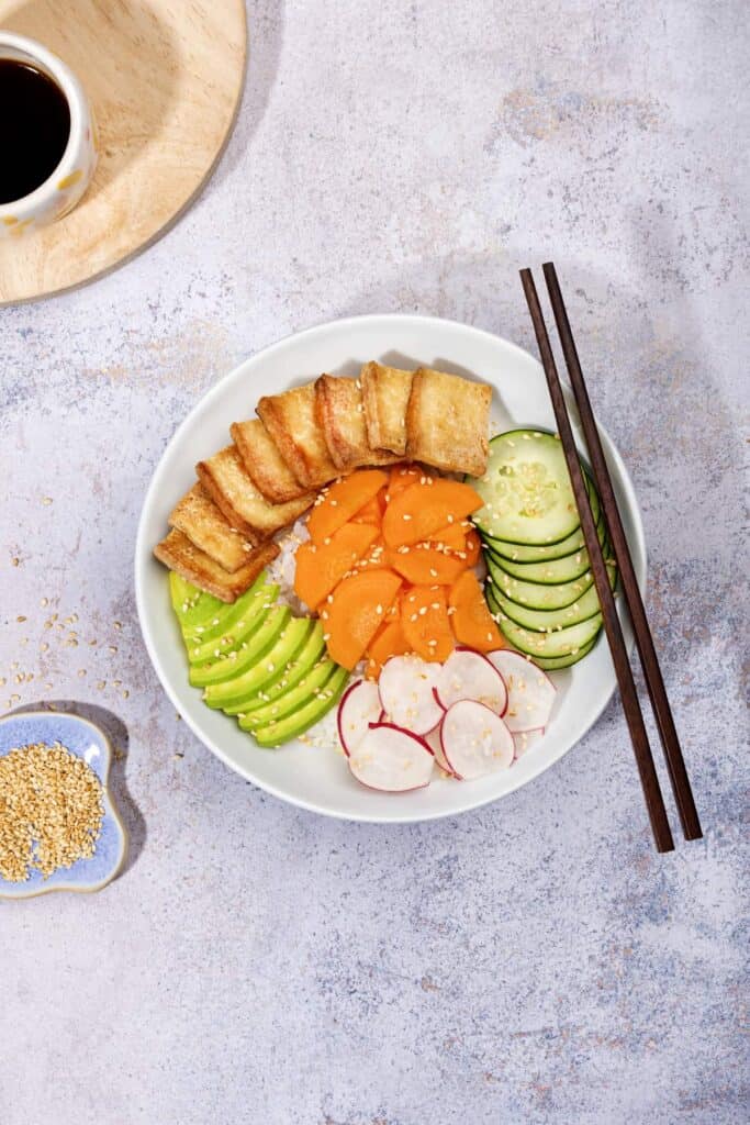 A sesame vegan poke bowl with chopsticks. | Hurry The Food Up